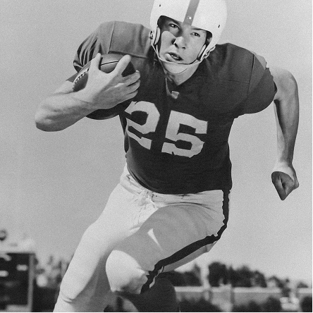 Archival black-and-white portrait of a football player