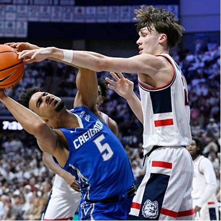 A Creighton basketball player wearing the Bluejays blue uniform